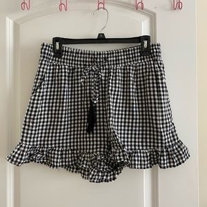 Black and white checked ruffle shorts with tassel